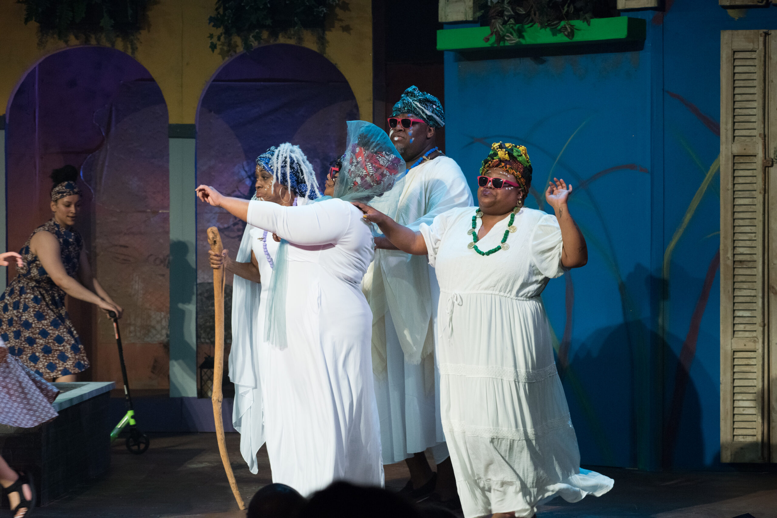 The gods of the island, played by Adrienne Degraftenreed, Anjelica McRae-Breathett, Alexander Ogburn, and Injoy Fountain (?: Jerry Fritchman)